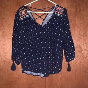 long sleeve, cinched at end of sleeves, laced back